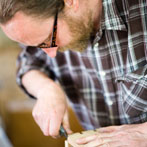 Ben Casson making a shelving unit in his workshop at Wobage Farm 2016